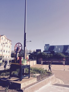 Hat press in foreground, 1930s railway station in the distance overshadowed by a hulking car park. I guess that shows you the priorities of the home of Vauxhall Motors.