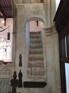 Medieval stairway reminiscent of Henry V's chapel at the Abbey with restored memorials inlaid in the wall and a glimpse of the roof.